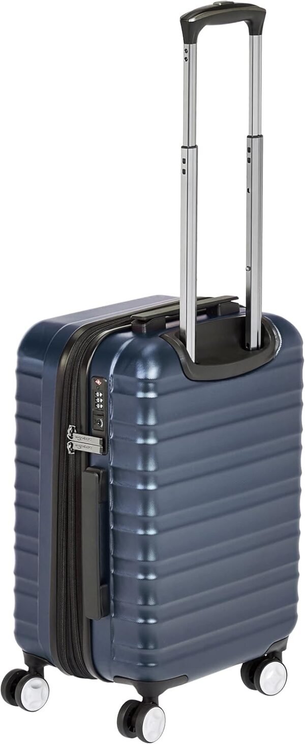 Amazon Basics 21-inch Carry On Luggage, Suitcase With Wheels (8 Spinner Wheels), TSA Lock, Expandable Space, Interior Divider and Pocket For Dry and Damp Clothes, Navy Blue - Image 4